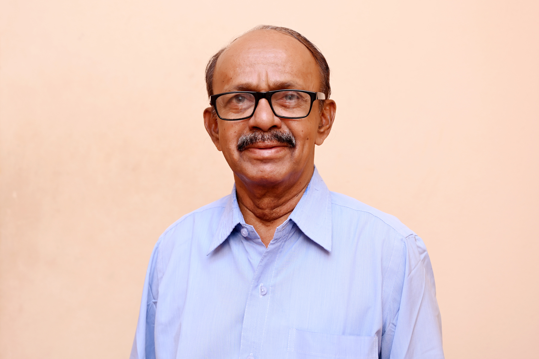 Photograph of Dinker Shetty K, Director